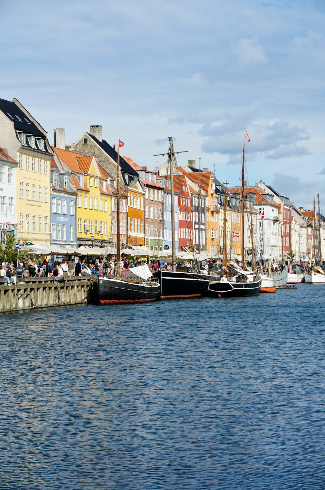 man standing by harbor in denmark