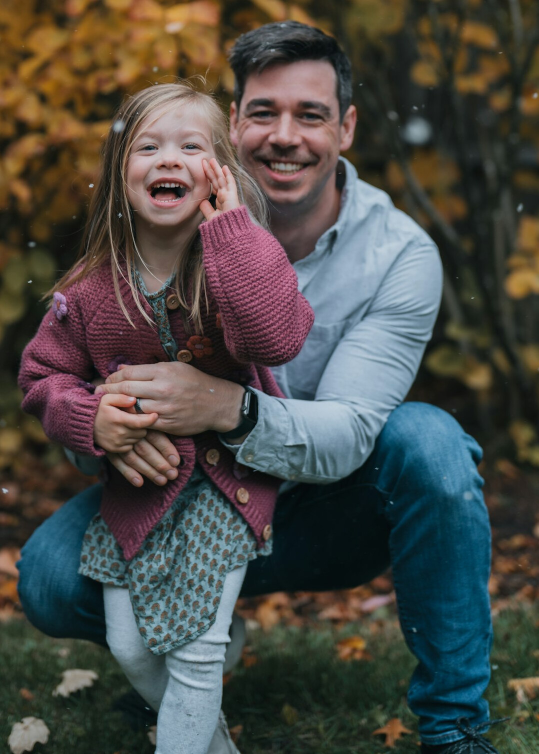 Danish father and child laughing together outdoors