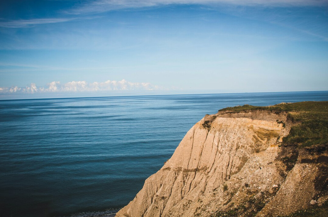 Danish coastal landscape with cliffs and sea at golden hour
